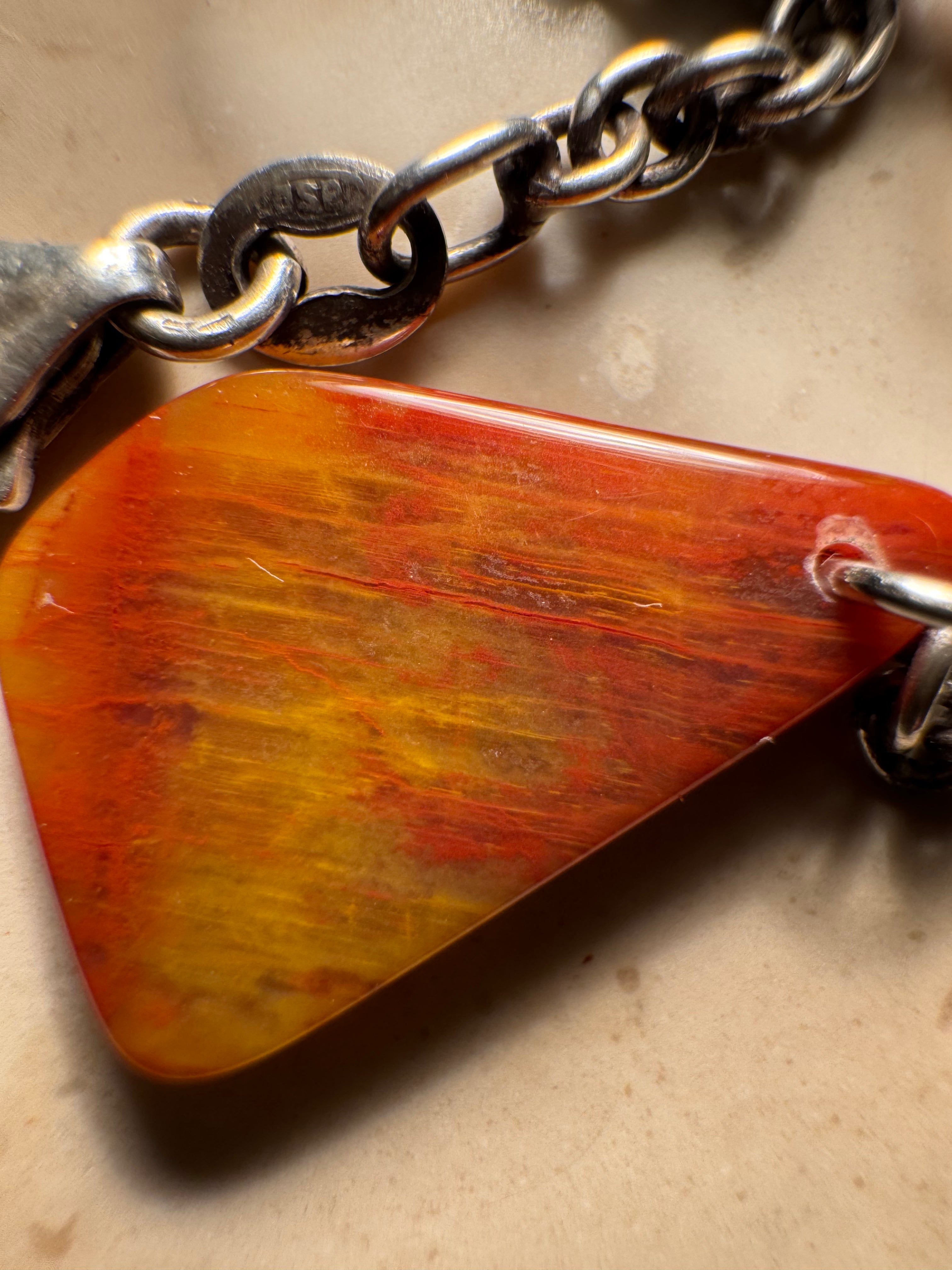 Handcrafted petrified rainbow wood pendant from Arizona