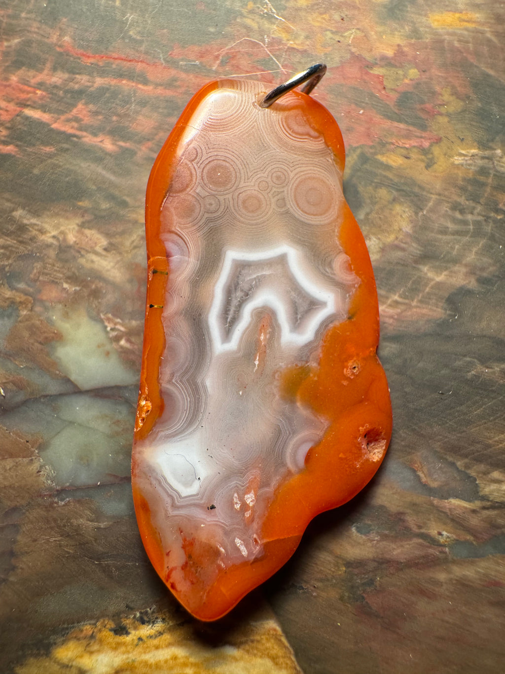 Agate pendant with eyes and fine bands, Morocco